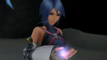 Aqua, holding her Wayfinder, in the Realm of Darkness.