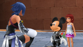 Young Kairi with Aqua and Mickey Mouse after they rescued her from the Unversed.
