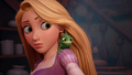 Rapunzel with Pascal on her shoulder.