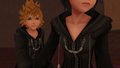 Roxas tries to stop Xion from running away.