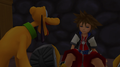 Sora wakes up in Traverse Town beside Pluto.